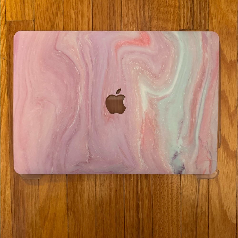 13-inch MacBook Air with a hard shell case, keyboard cover, and dust plugs